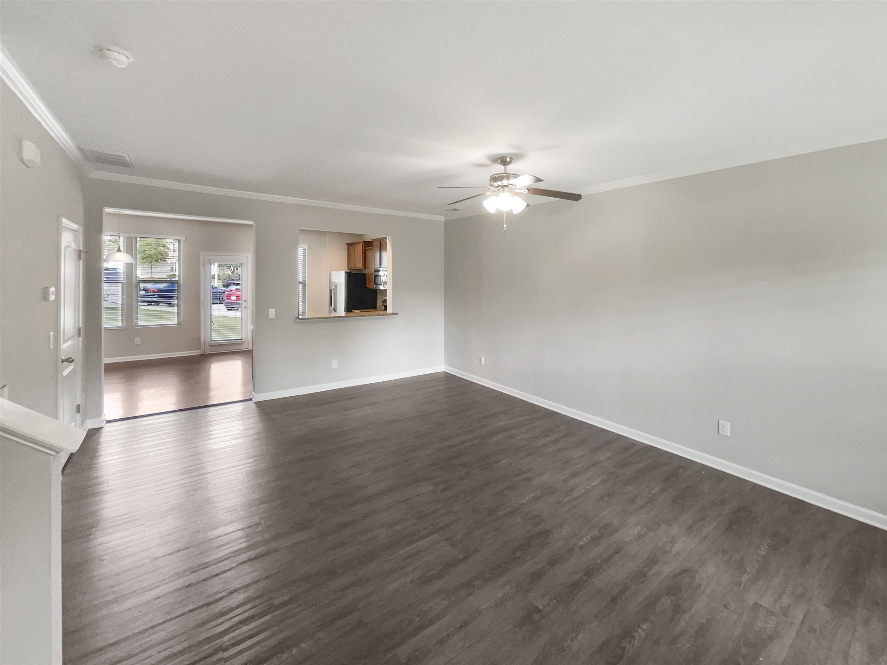 4445 Iyar Way Wake Forest, NC 27587 - Photo 7 of 17 an empty room with wooden floor and ceiling fan