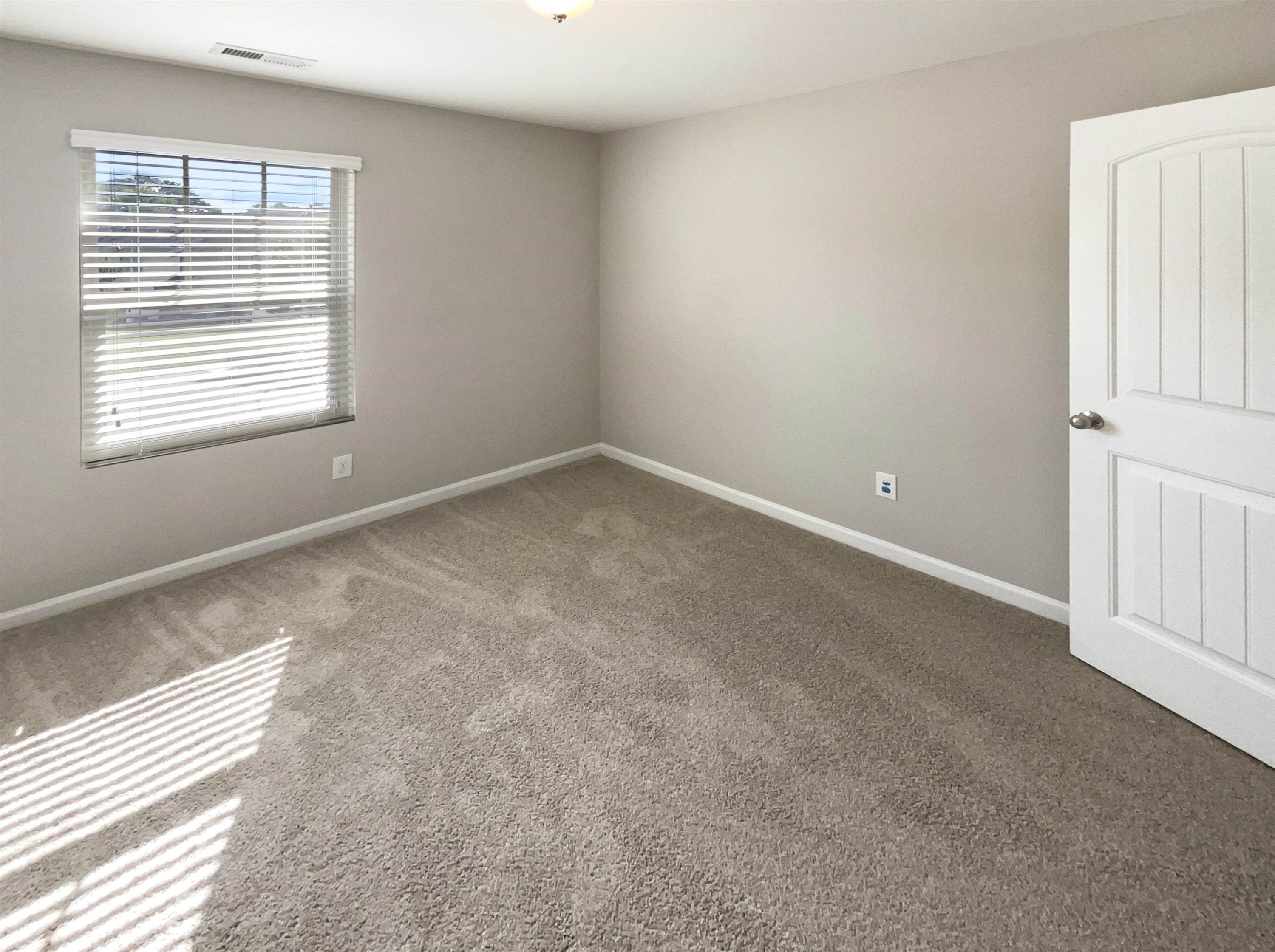 4445 Iyar Way Wake Forest, NC 27587 - Photo 9 of 17 an empty room with a window