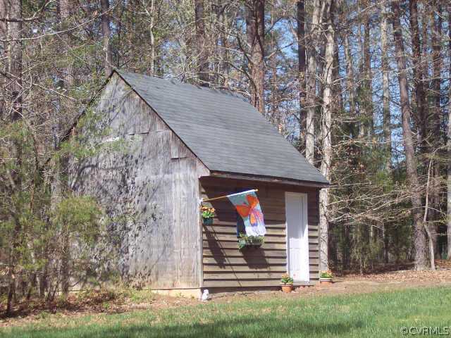 16150 Hopeful Church Road Bumpass, VA 23024 - Photo 10 of 10 a view of a house with a small yard