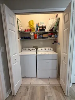 a utility room with dryer and washer
