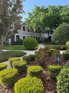 a view of a garden with a house
