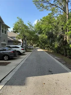 a view of street with parked cars
