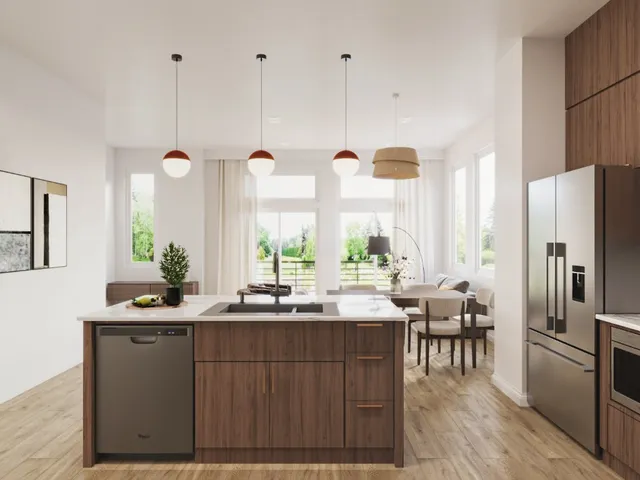 a kitchen with a refrigerator a sink dishwasher and white cabinets with wooden floor