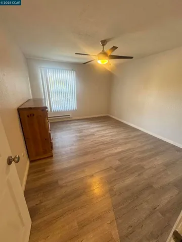a bathroom with a sink and mirror with shower