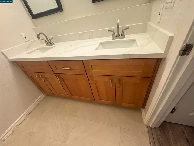 a view of a kitchen with an empty space and a window