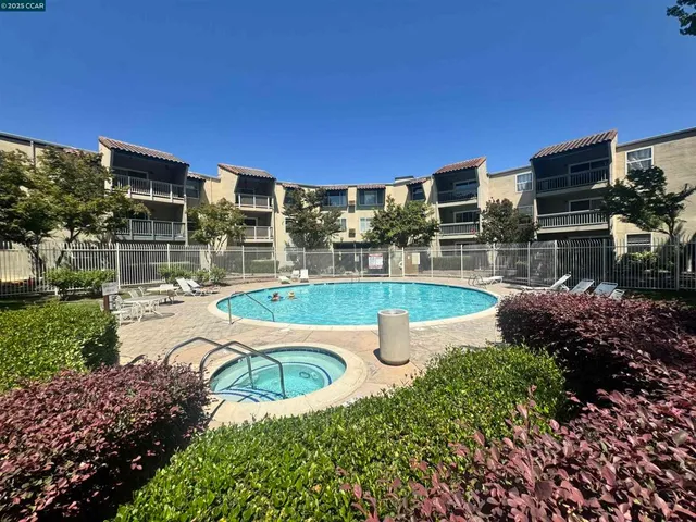 a view of a swimming pool with a patio