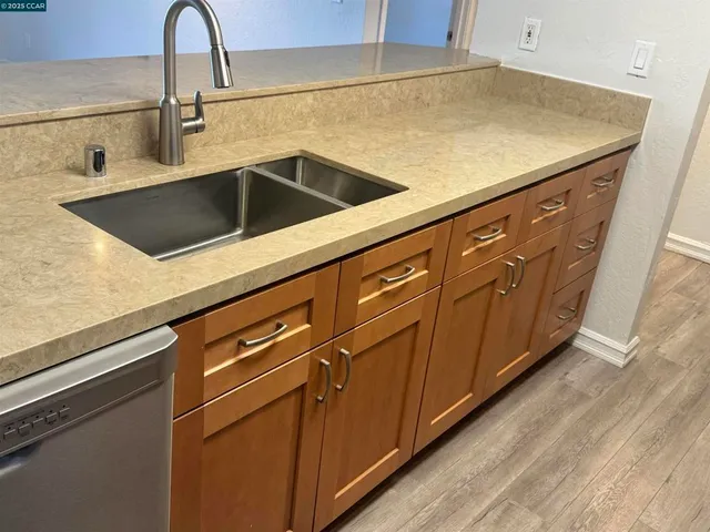 a bathroom with a double vanity sink and mirror