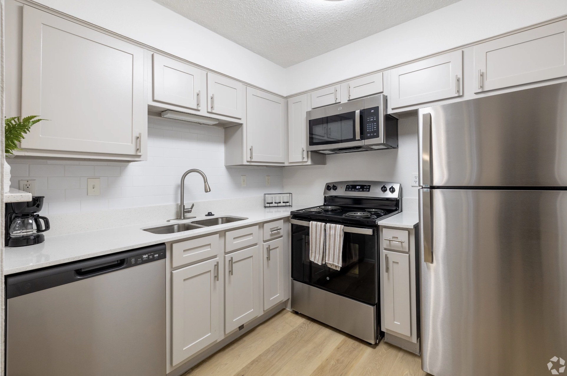 2170 Thousand Oaks Drive, Unit 1025T San Antonio, TX 78232 - Photo 4 of 36 a kitchen with stainless steel appliances granite countertop a refrigerator sink and stove