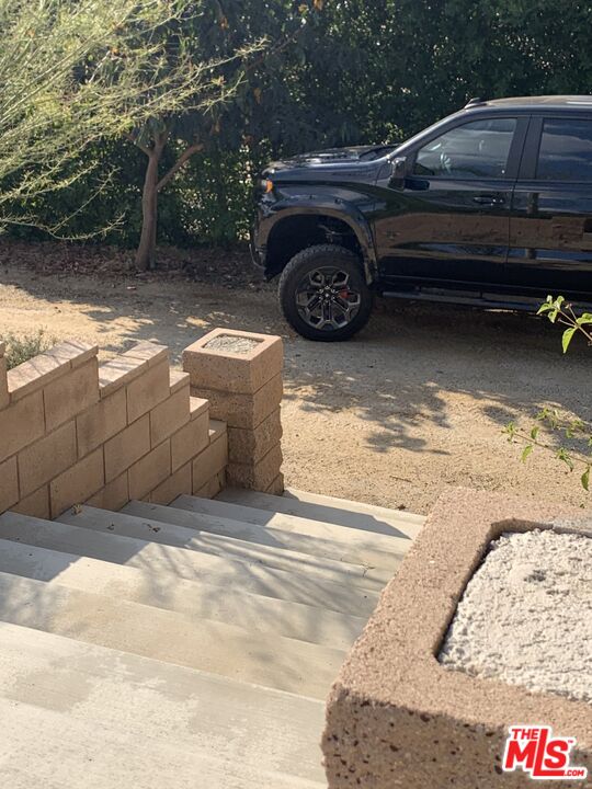 17197 Birch Hill Road Riverside, CA 92504 - Photo 8 of 23 a view of backyard with a car parked in it