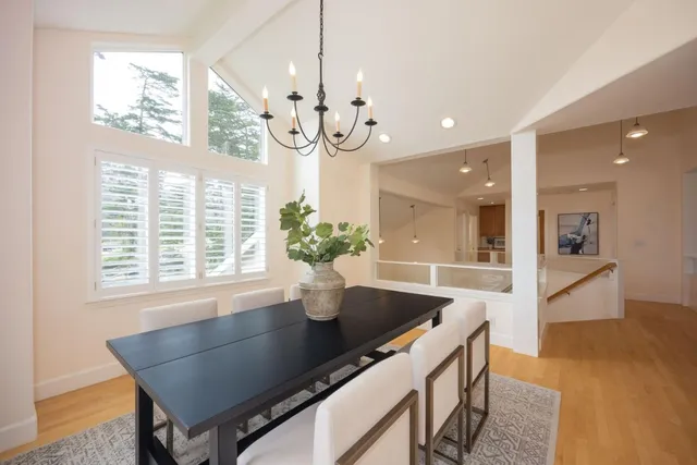 a dining room with furniture and window