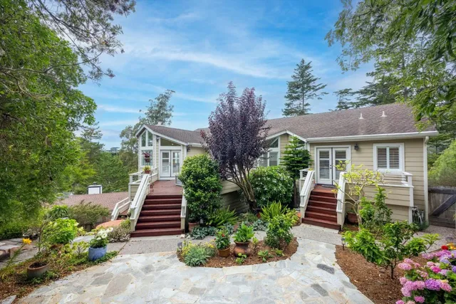a front view of house with yard and green space