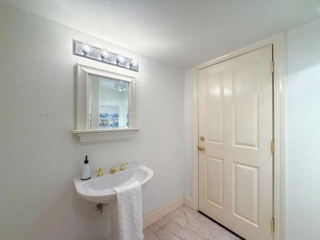 a view of a balcony with chairs