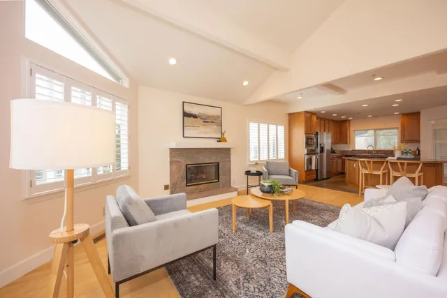 a kitchen with stainless steel appliances granite countertop a stove refrigerator sink and cabinets