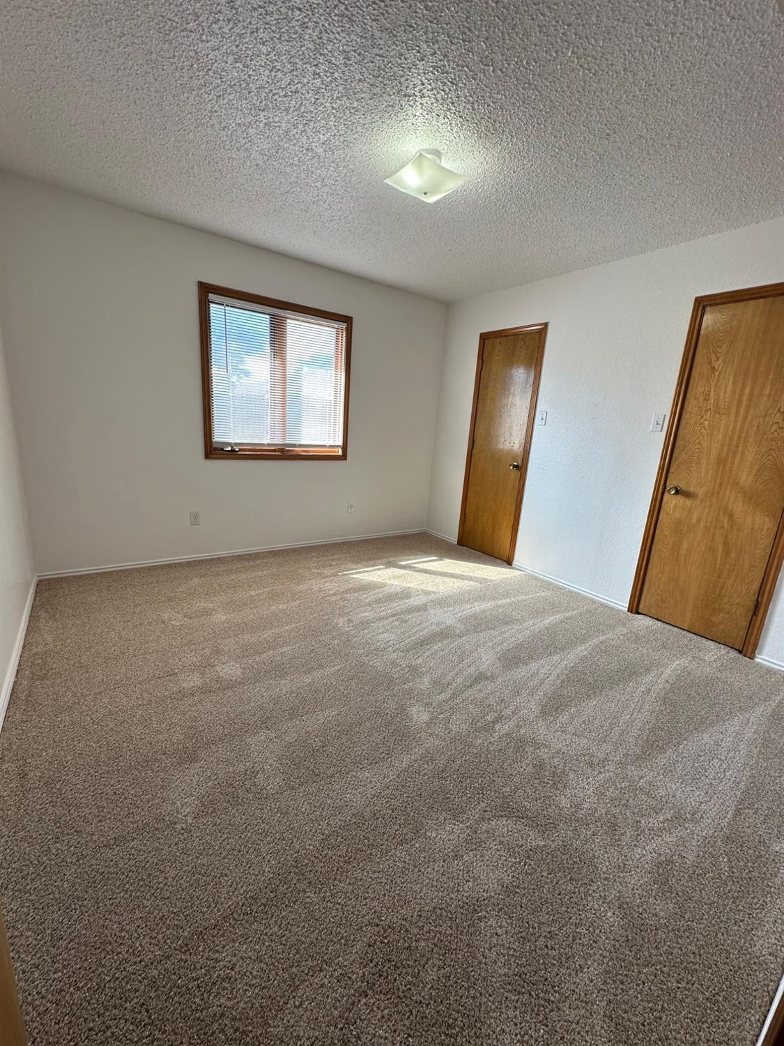 5609 88th Street Lubbock, TX 79424 - Photo 18 of 21 a view of an empty room with a window