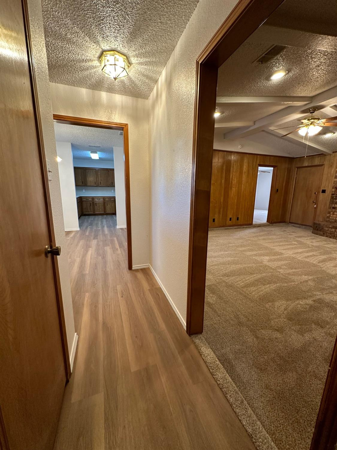 5609 88th Street Lubbock, TX 79424 - Photo 3 of 21 a view of a hallway with wooden floor and staircase