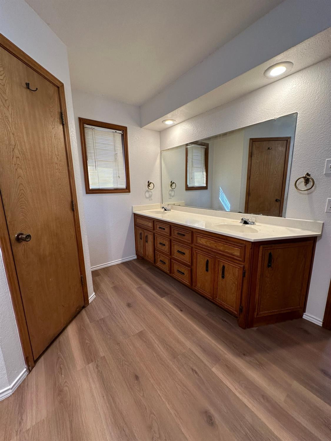 5609 88th Street Lubbock, TX 79424 - Photo 10 of 21 a room with wooden floors and wooden cabinets