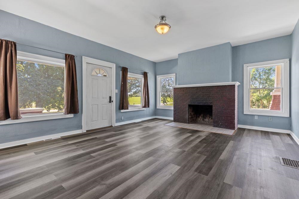 5987 Prairie Road Rockford, IL 61102 - Photo 3 of 21 a view of an empty room with window and fire place
