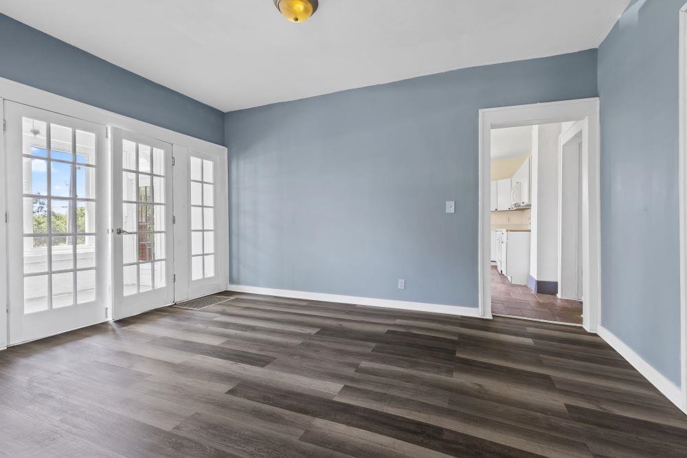 5987 Prairie Road Rockford, IL 61102 - Photo 4 of 21 a view of an empty room with wooden floor and a window