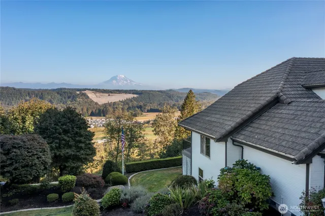an aerial view of house with ocean view