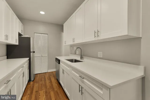 a kitchen with a sink a stove and refrigerator