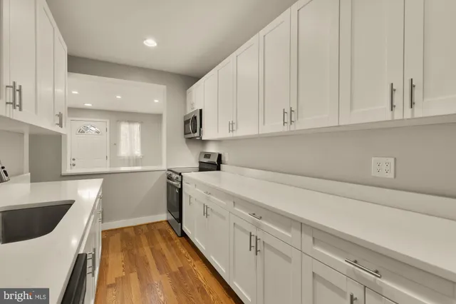 a kitchen with a sink and cabinets