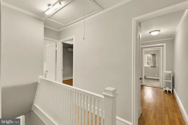 a view of hallway with wooden floor