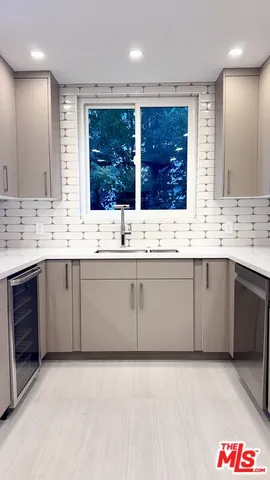 a view with a sink and a mirror