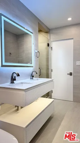 a bathroom with a tub and a sink