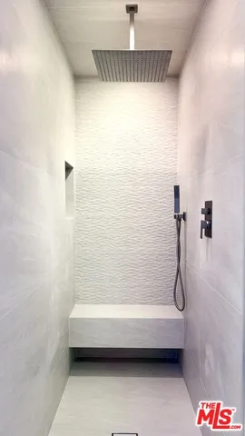 a bathroom with a shower and a bathtub