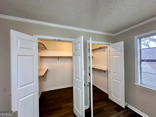 a view of walk in closet with window