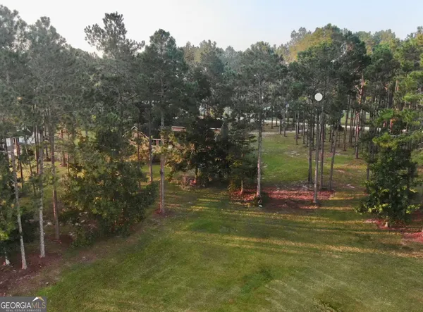 a view of a swimming pool with an outdoor seating