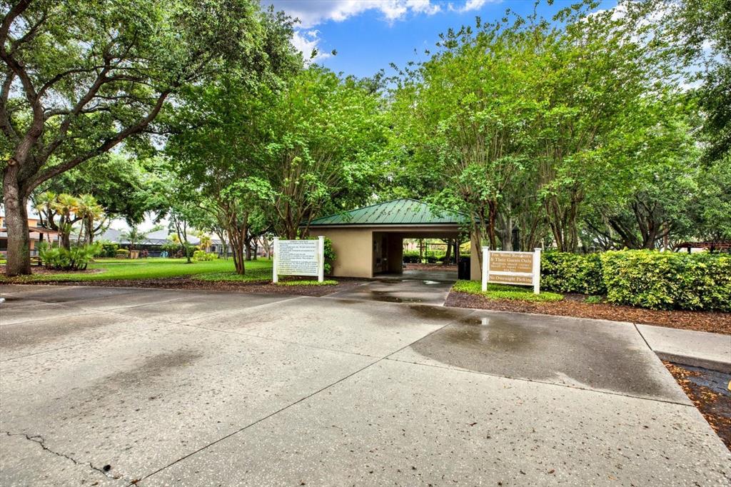 2021 Meadow Rue Court Trinity, FL 34655 - Photo 39 of 41 a view of a house with a yard and garage