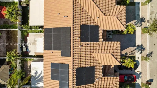 a front view of a house with outdoor seating