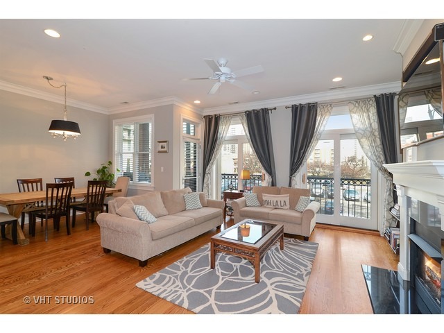 220 North Halsted Street, Unit 2 Chicago, IL 60661 - Photo 3 of 13 a living room with furniture and a large window