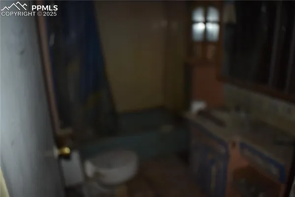 a view of an empty room with wooden door