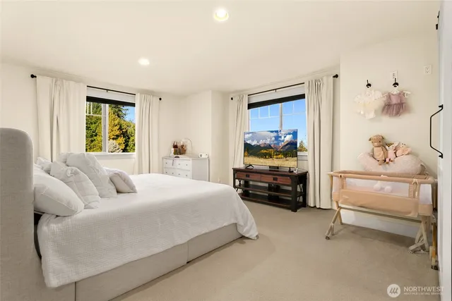 a bedroom with furniture and a window