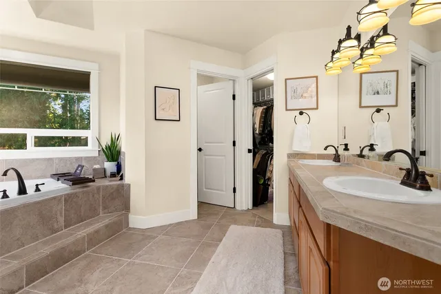 a bathroom with a granite countertop sink a toilet and a mirror