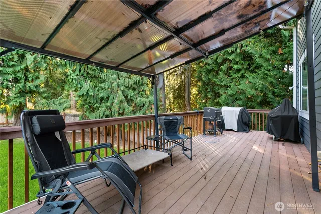 a front view of a house with a yard and green space