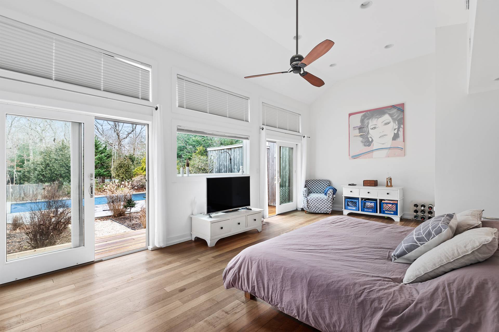 18 Renees Way East Hampton, NY 11937 - Photo 4 of 6 a bedroom with a large bed and a flat tv screen