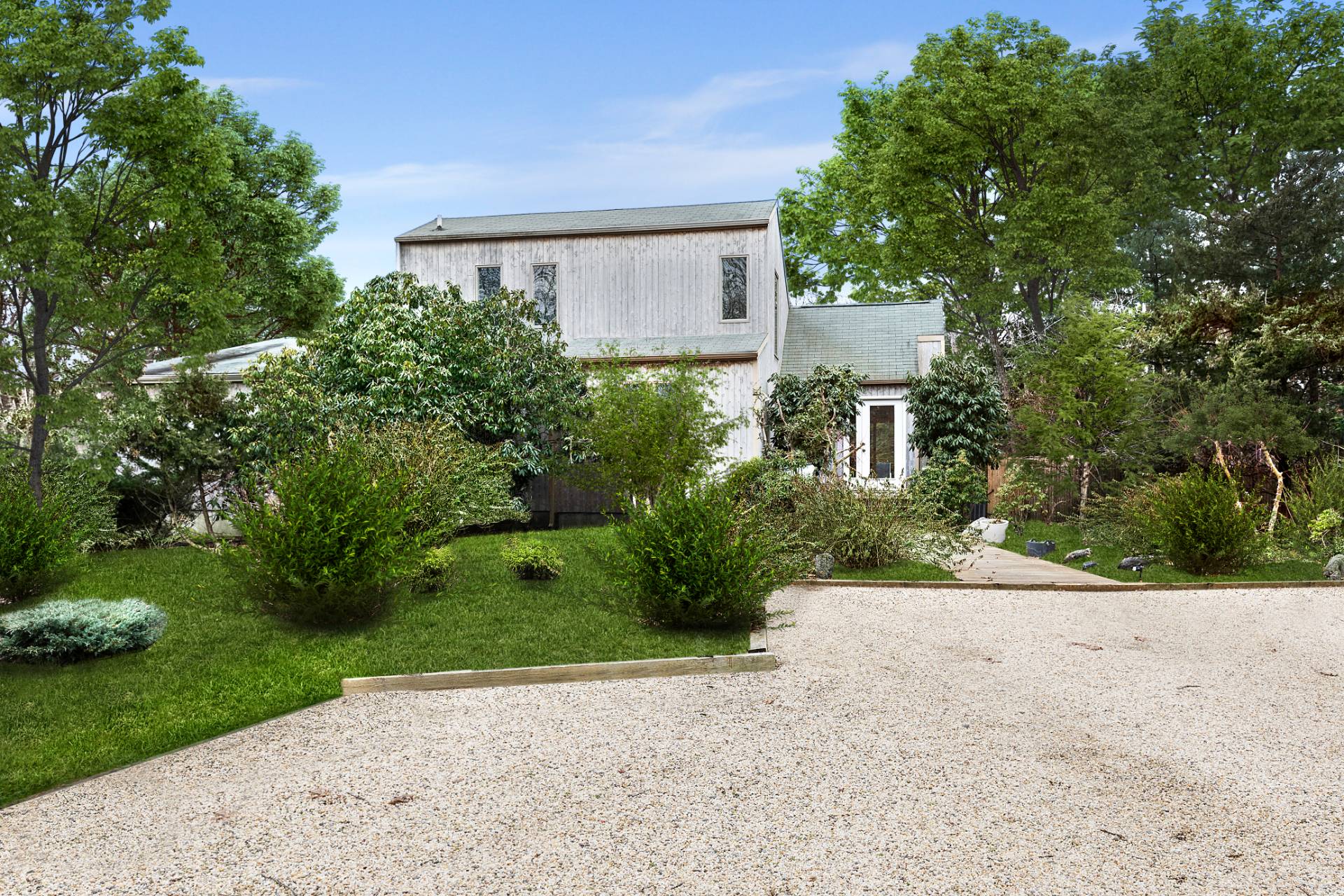 18 Renees Way East Hampton, NY 11937 - Photo 6 of 6 a front view of a house with a yard and a garage