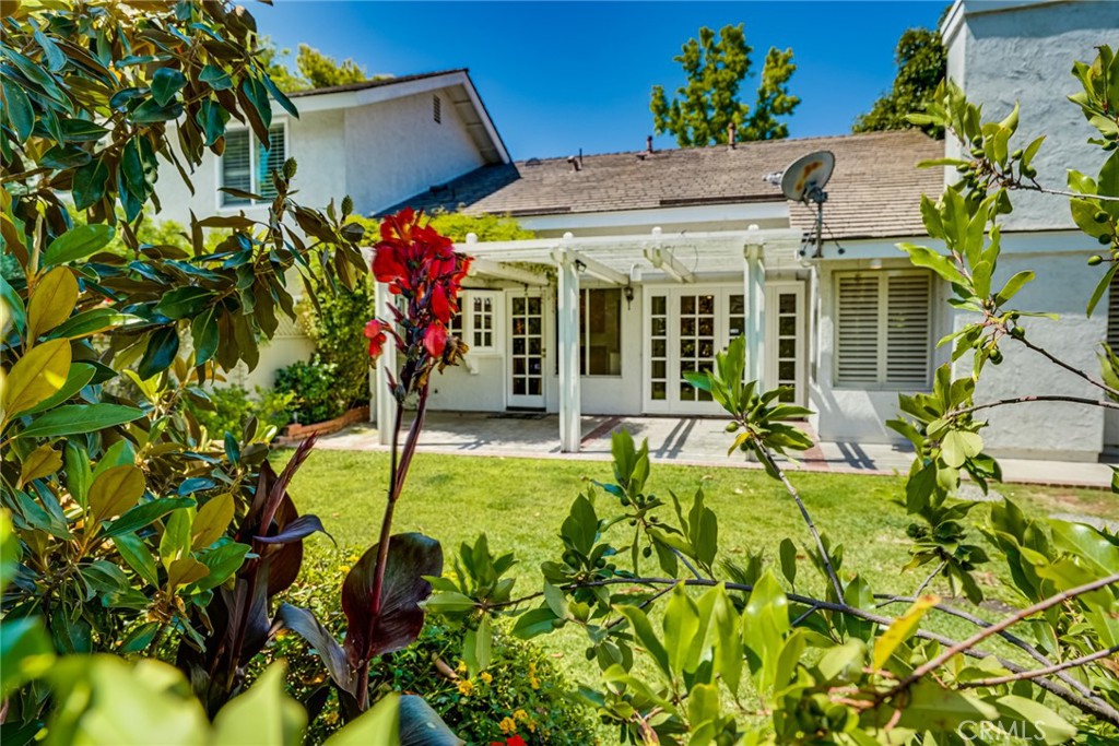 49 East Yale Loop, Unit 26 Irvine, CA 92604 - Photo 51 of 63 a view of a house with fountain and potted plants