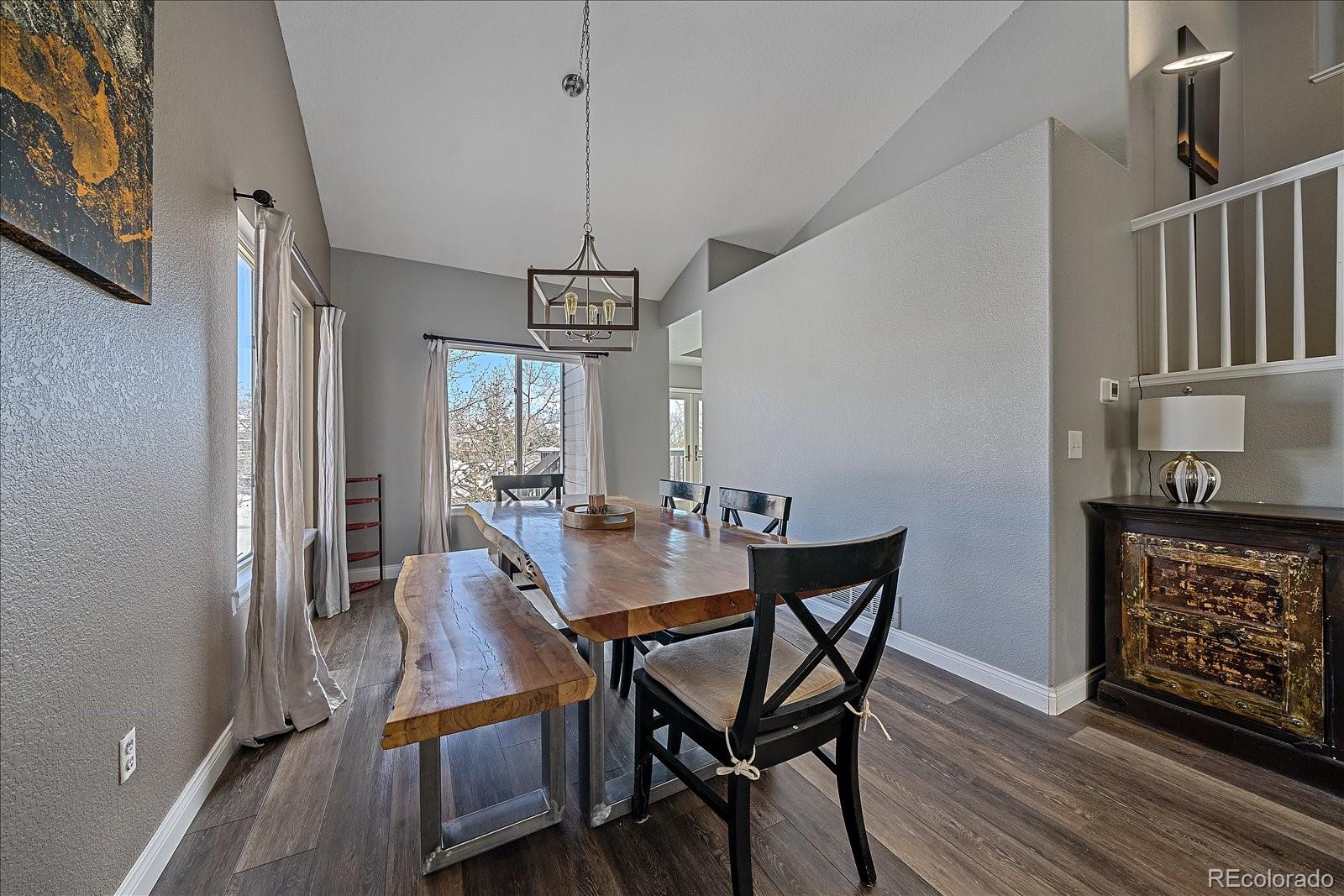 722 Calgary Way Golden, CO 80401 - Photo 12 of 50 a view of a dining room with furniture window and wooden floor