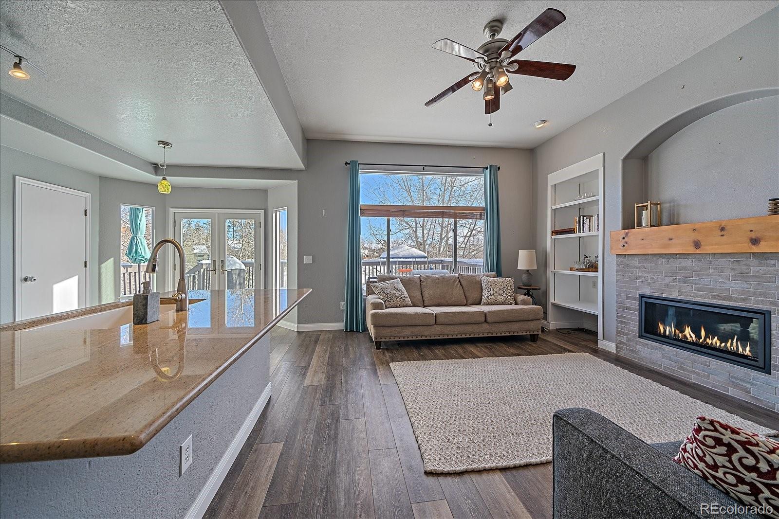 722 Calgary Way Golden, CO 80401 - Photo 13 of 50 a living room with furniture and a fireplace