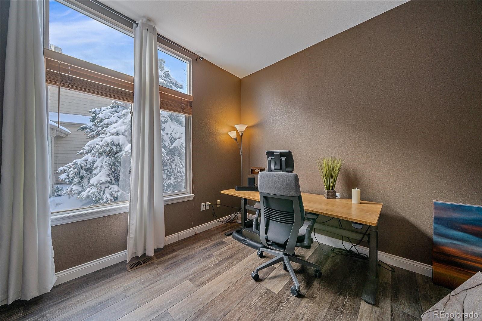 722 Calgary Way Golden, CO 80401 - Photo 20 of 50 a view of a workspace with furniture and a window