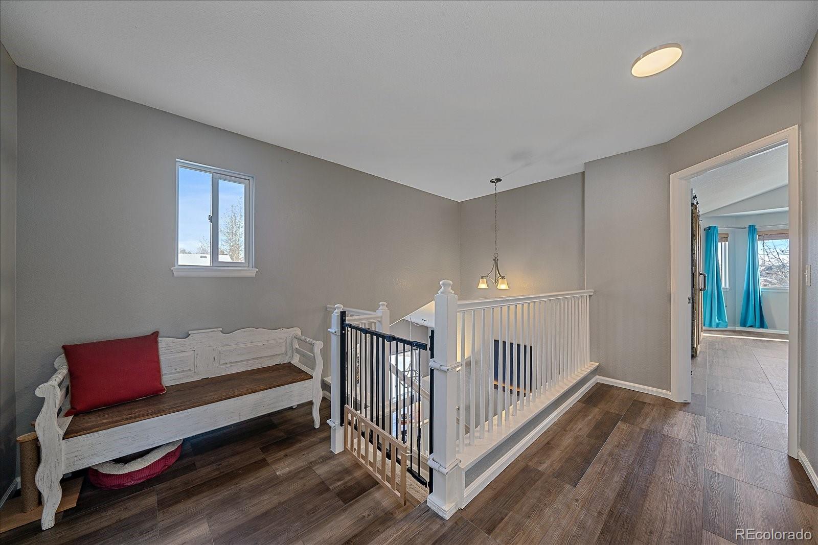 722 Calgary Way Golden, CO 80401 - Photo 22 of 50 a bedroom with furniture and a window
