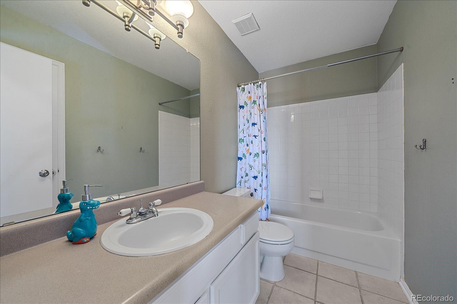 722 Calgary Way Golden, CO 80401 - Photo 30 of 50 a bathroom with a sink a toilet and shower