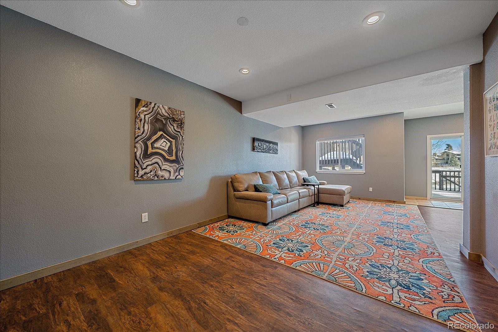 722 Calgary Way Golden, CO 80401 - Photo 31 of 50 a bedroom with a bed and a couch