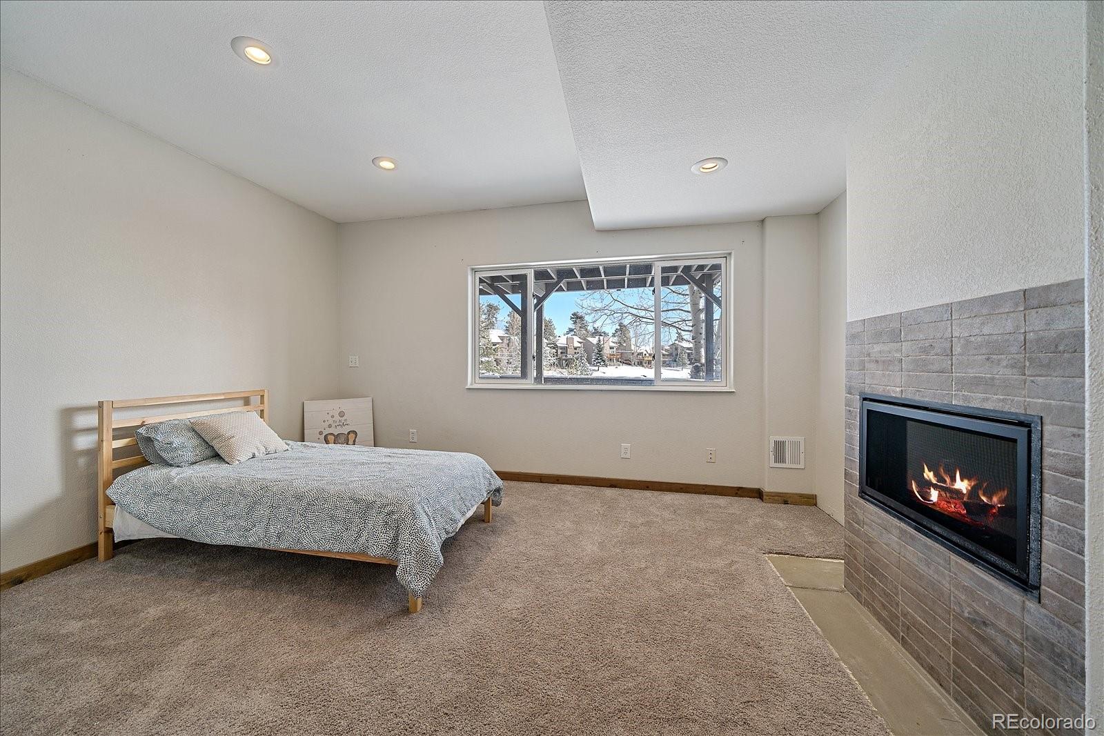722 Calgary Way Golden, CO 80401 - Photo 35 of 50 a living room with furniture and a fireplace
