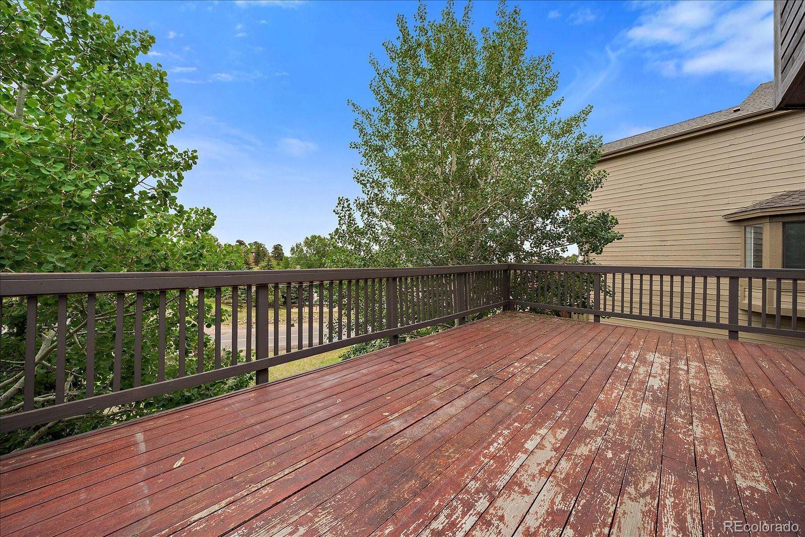 722 Calgary Way Golden, CO 80401 - Photo 41 of 50 a view of wooden deck and a garden