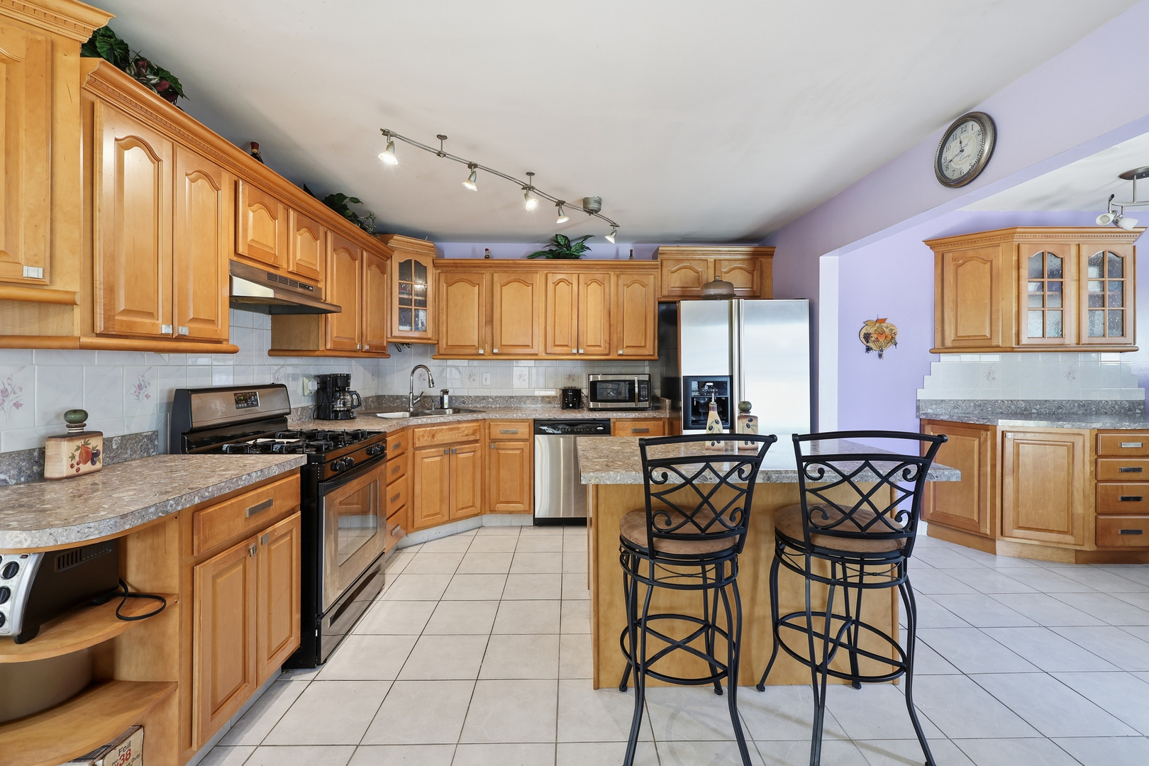 329 East Myrick Avenue Addison, IL 60101 - Photo 4 of 30 a kitchen with a dining table chairs and a refrigerator